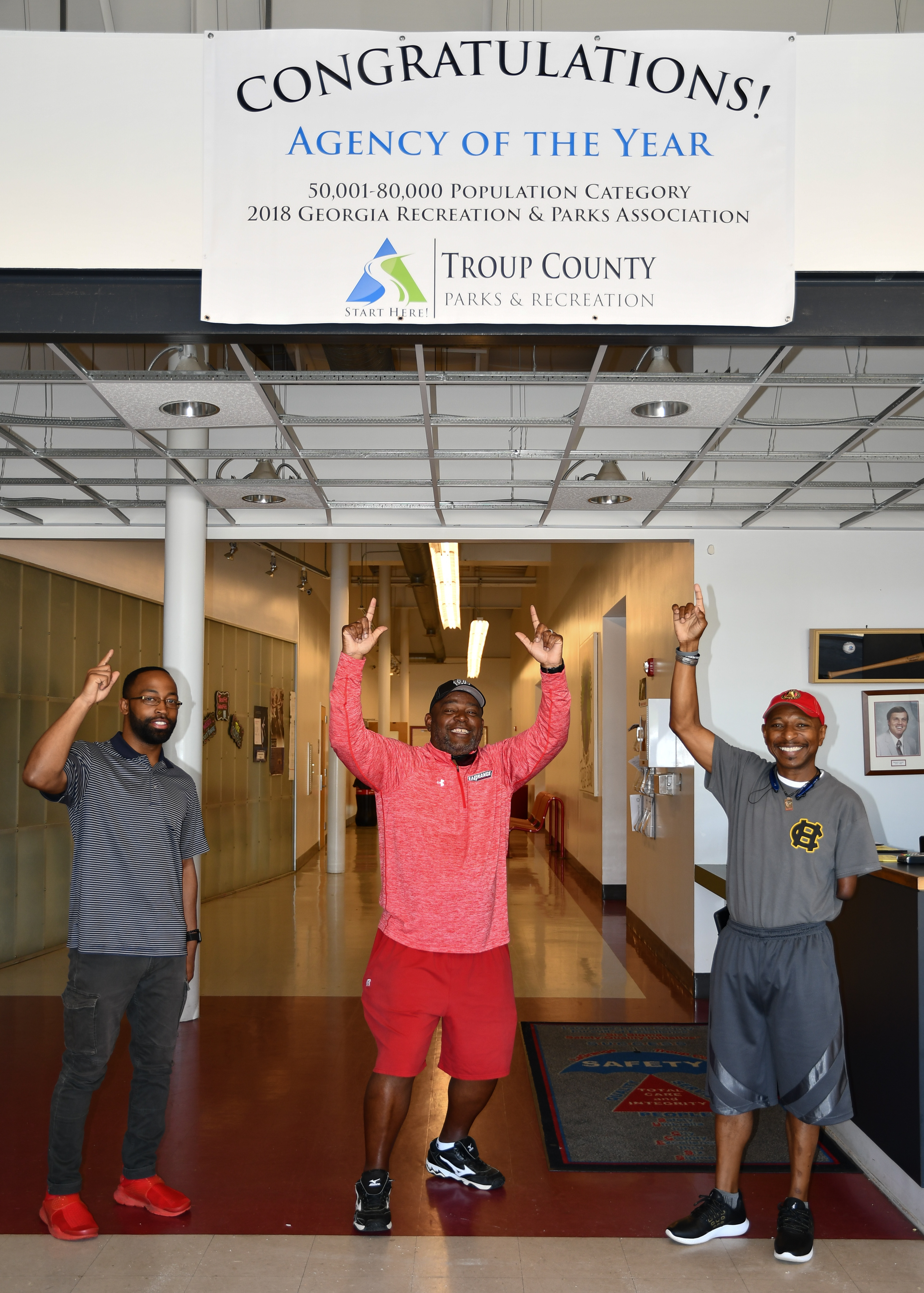 agency of the year - troup county ga parks and recreation, employees pose with agency of the year sign